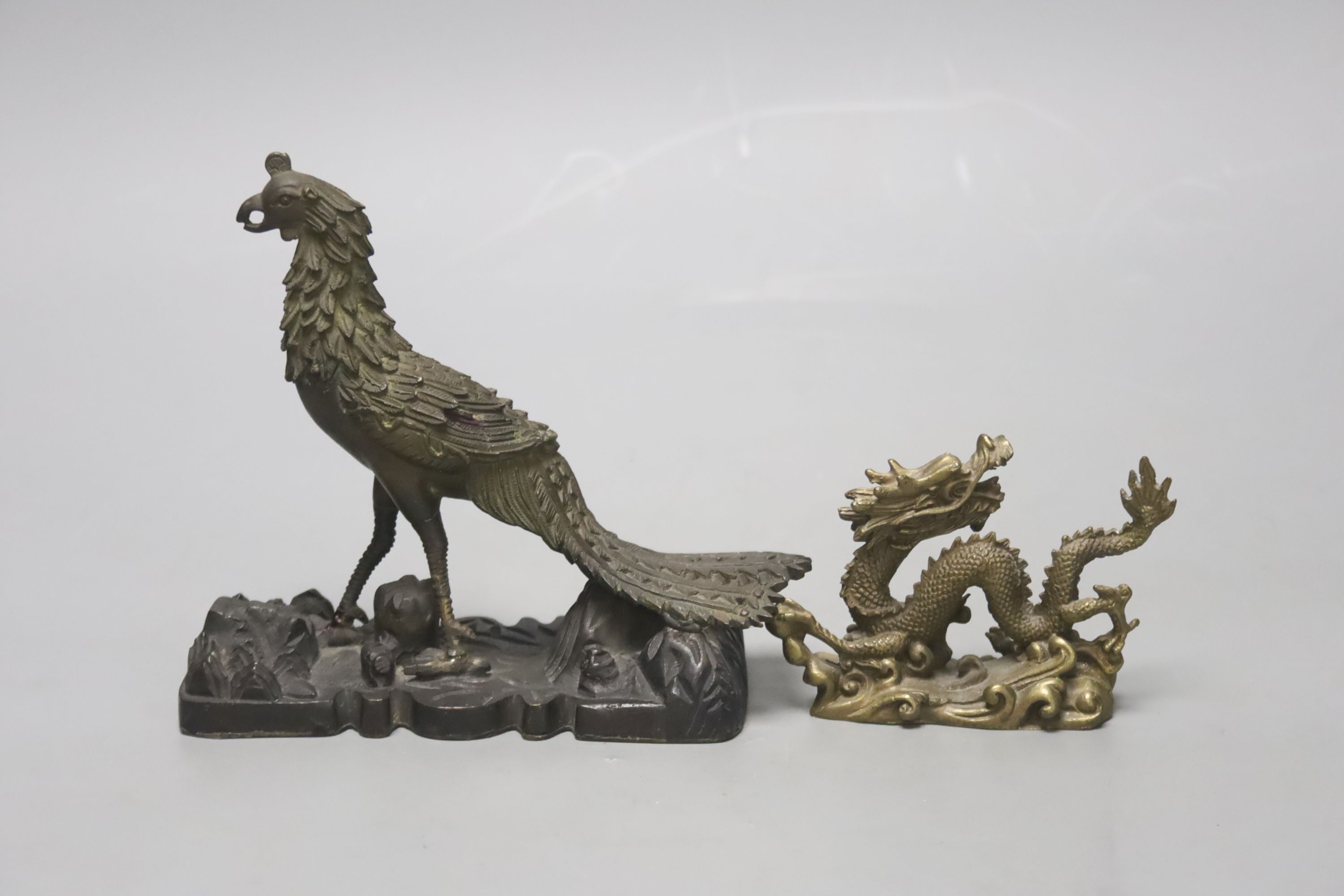 A 19th century Chinese bronze figure of a phoenix, repairs, and a 20th century Chinese bronze figure of a dragon, tallest 13.5cm